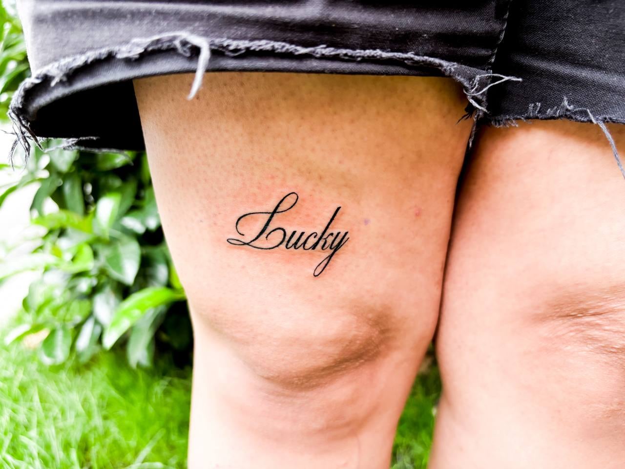 lucky handwriting tattoo — tattoo by spiral, tbilisi